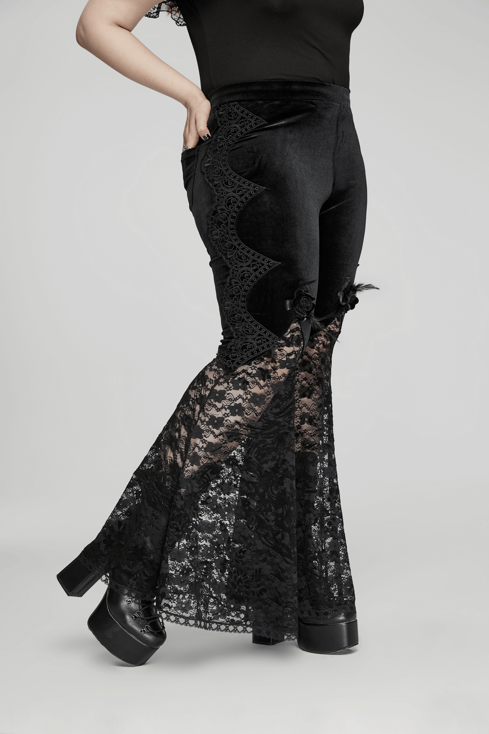 Gothic velvet and lace flared pants with rose trim showcasing intricate lace details and flattering fit.