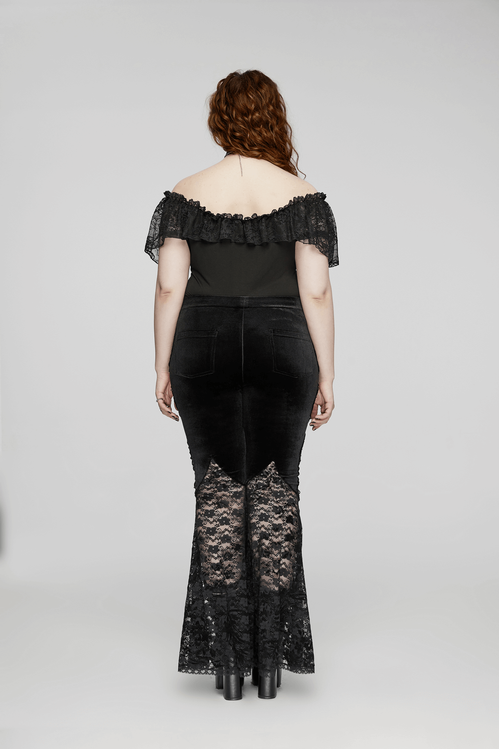 Back view of Gothic Velvet and Lace Flared Pants with Rose Trim, showcasing elegant lace detailing and pockets.