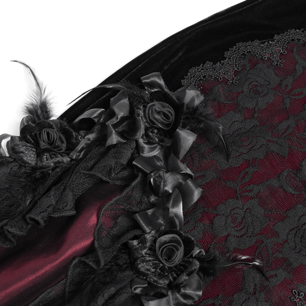 Close-up of velvet and lace details with black roses and feathers on a gothic dress.