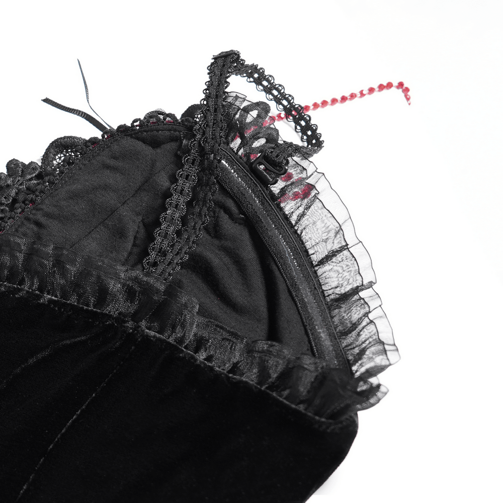 Close-up of the gothic velvet dress neckline with lace trim and a red beaded detail, showcasing elegant Victorian style.