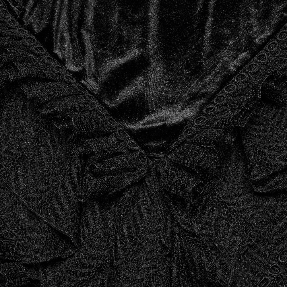 Close-up of Gothic velvet and lace ruffle details on a black skirt, showcasing intricate mesh detailing.