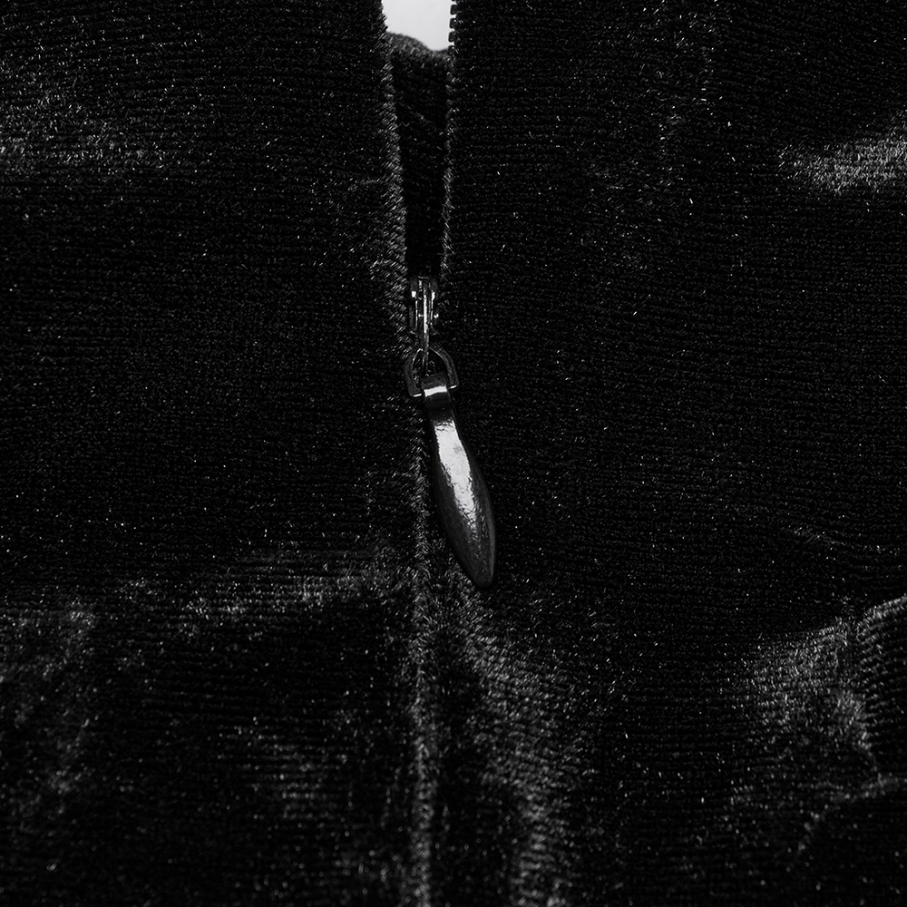 Close-up of a stylish black velvet zipper detail on a Gothic skirt, showcasing luxurious texture and intricate design.