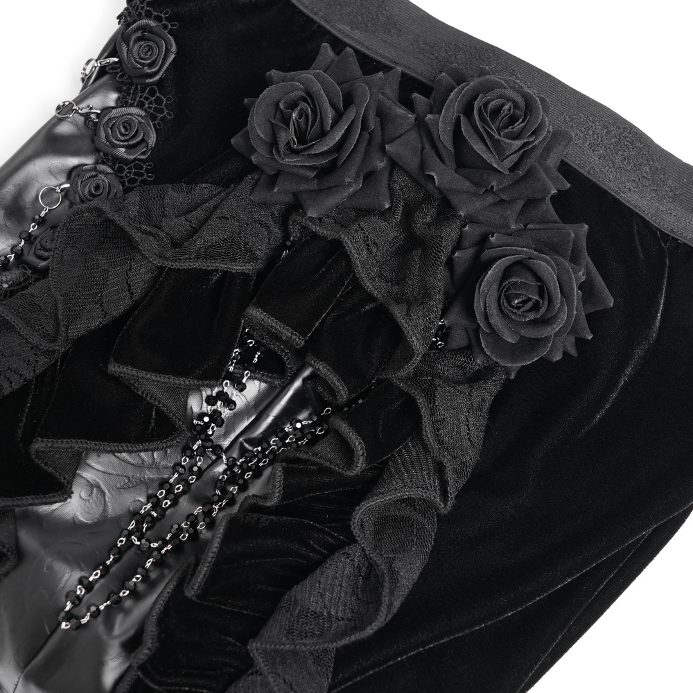 Gothic velvet and leather pants showcasing black lace ruffles and rose appliqués, perfect for a dramatic silhouette.