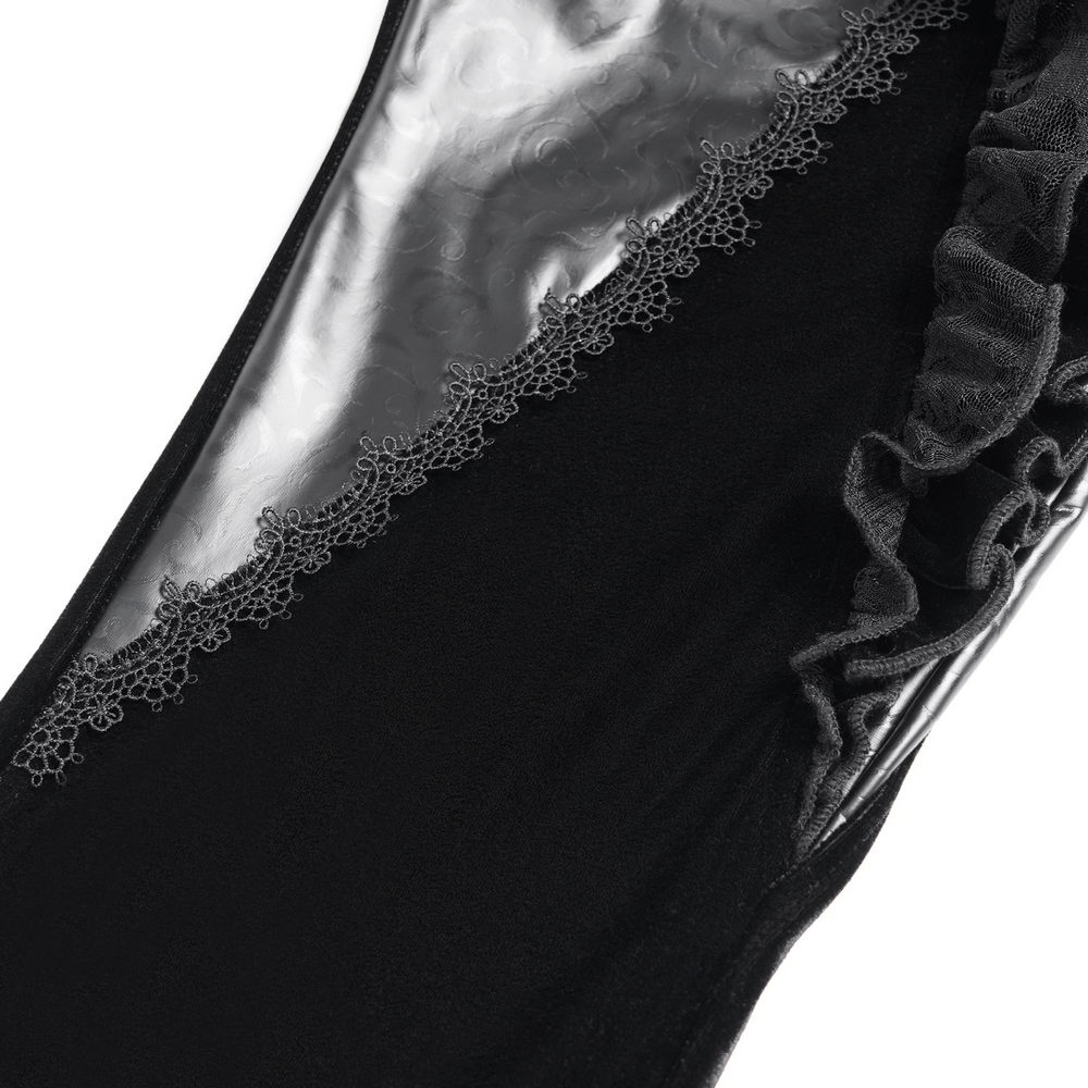 Close-up of Gothic velvet and leather flare pants showcasing lace ruffles and floral detailing.