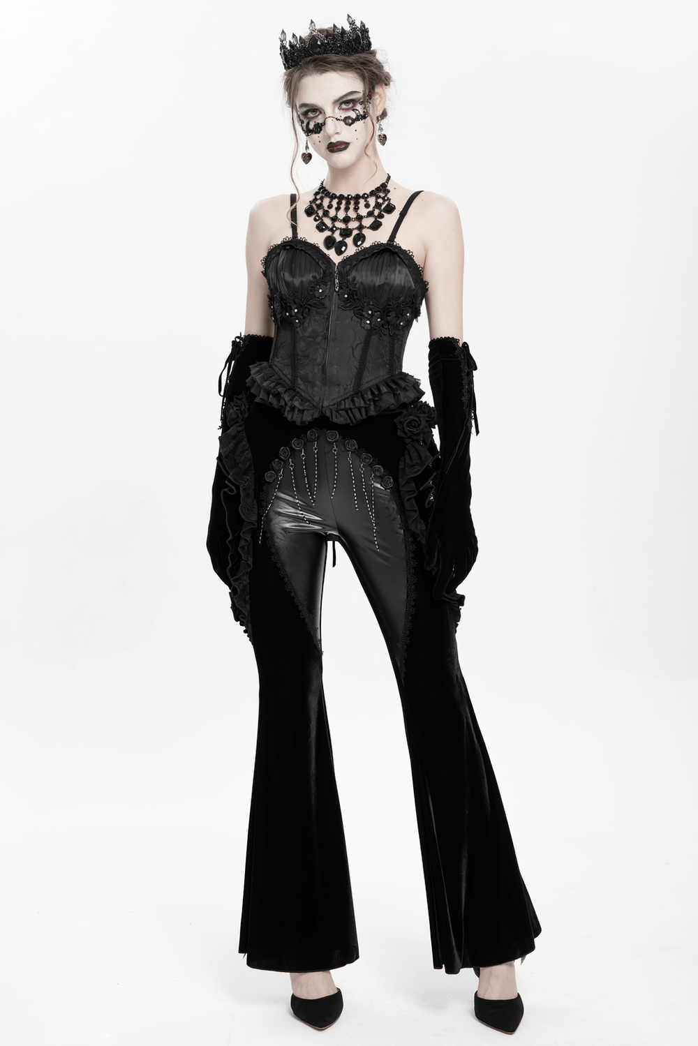 Gothic velvet and leather flare pants paired with a lace-trimmed corset and accessories for a dramatic dark elegance.
