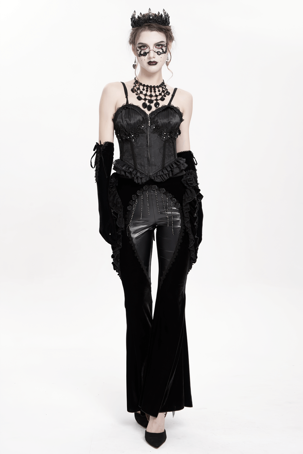 Gothic velvet and leather flare pants with lace ruffles; striking Victorian-inspired fashion.
