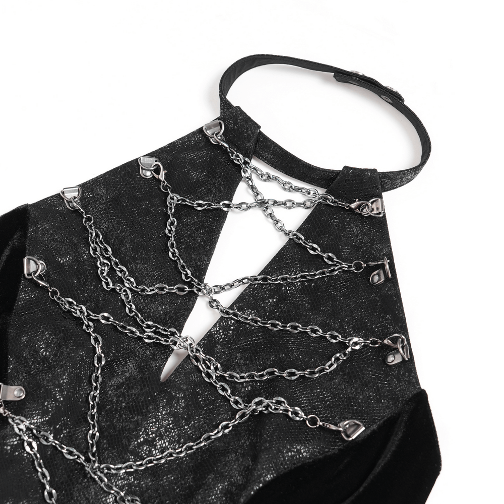 Close-up of gothic velvet maxi dress with chains and halter neckline details, perfect for dark alternative fashion.