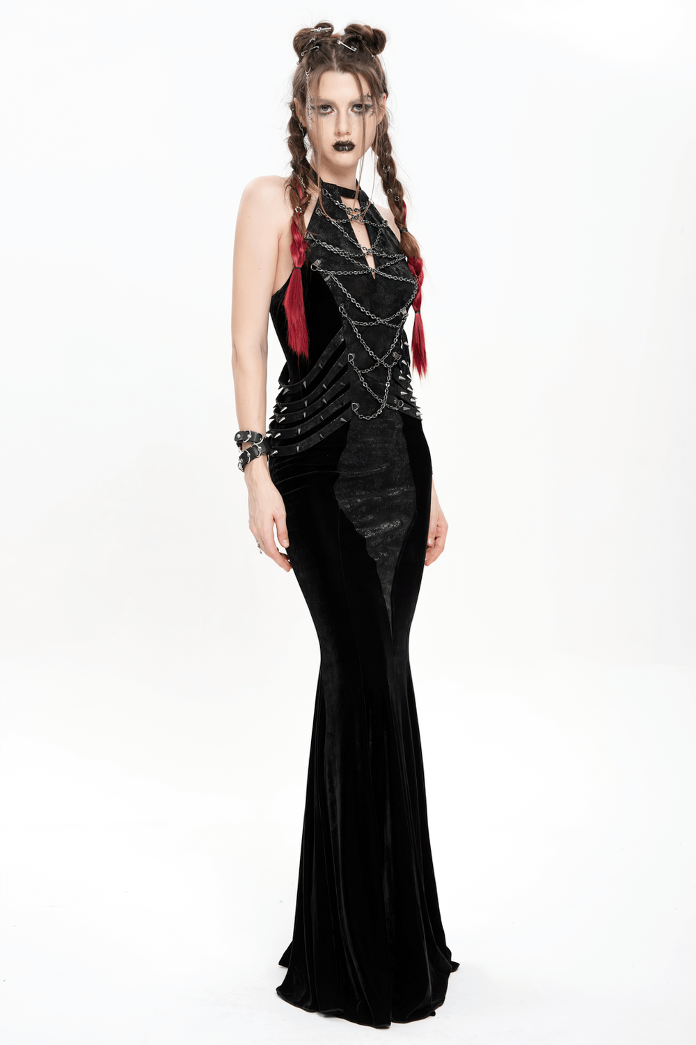 Gothic velvet chain maxi dress with halter neckline, featuring faux leather straps and chains for a dramatic evening look.