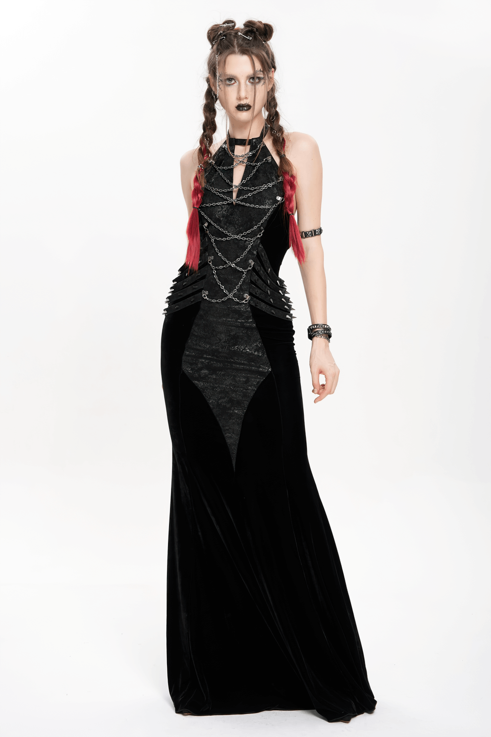 Gothic velvet maxi dress with halter neckline, chains, and faux leather straps, perfect for alternative evening wear.