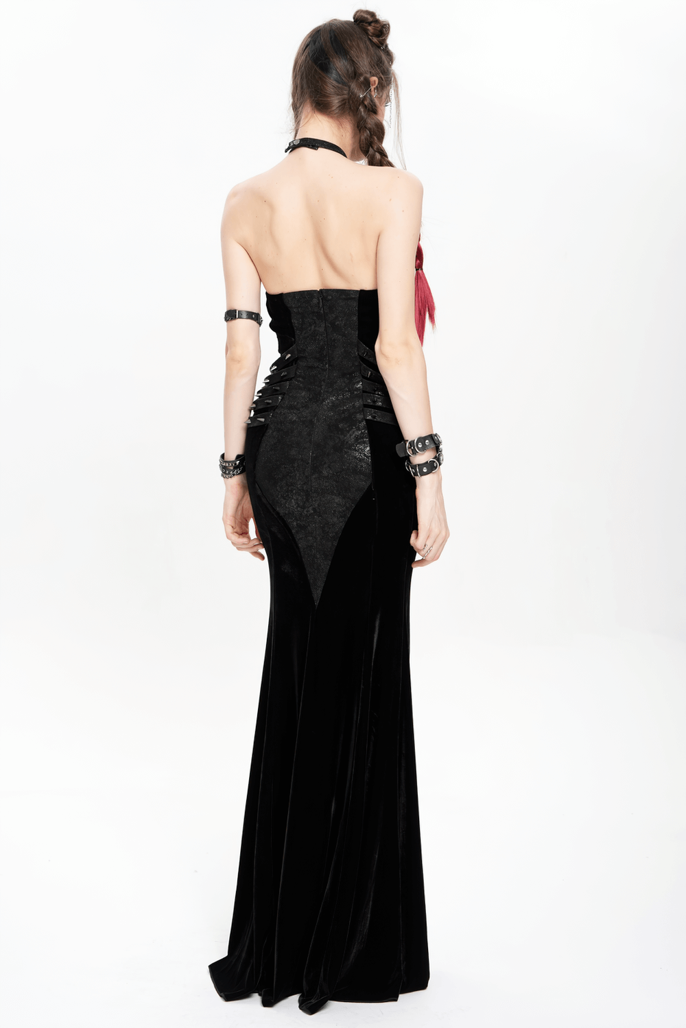Back view of gothic velvet chain maxi dress with halter neckline and faux leather accents, perfect for alternative evening wear.