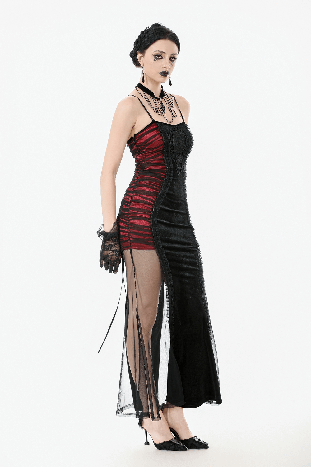 Gothic model in a black and red dress with lace, showcasing dramatic style and elegance for alternative fashion.