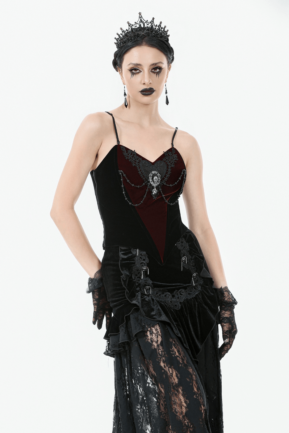 Gothic velvet corset top with lace and chain details, featuring a sweetheart neckline and elegant accessories.