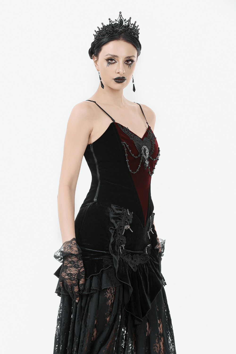 Gothic velvet corset top with lace and chain details, perfect for alternative fashion and events.