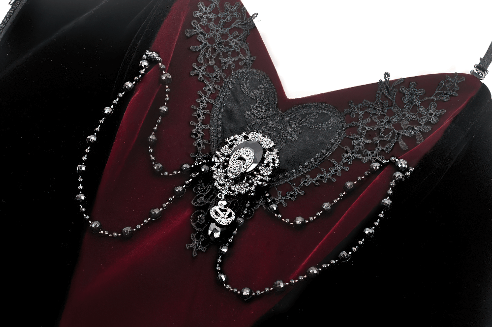 Gothic velvet corset top with lace and chain details, featuring an intricate heart design and beaded embellishments.