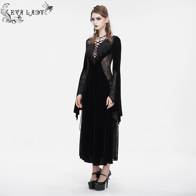 Gothic velvet dress with floral embroidery and flared sleeves, embodying dark elegance and romantic style.