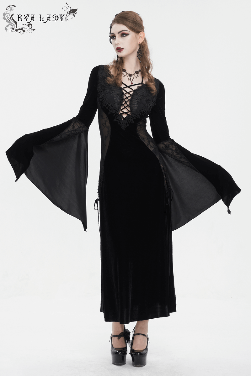 Gothic velvet dress with floral embroidery and flared sleeves, embodying dark elegance and romantic charm.