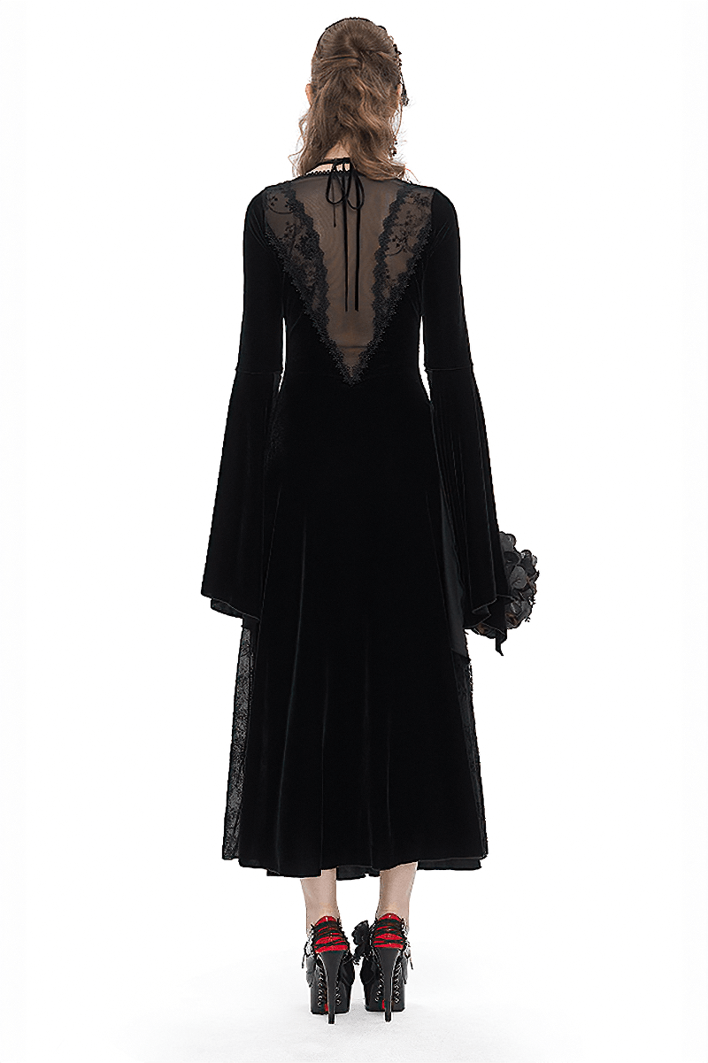 Rear view of a gothic velvet dress with flared sleeves and lace detailing, showcasing romantic elegance.