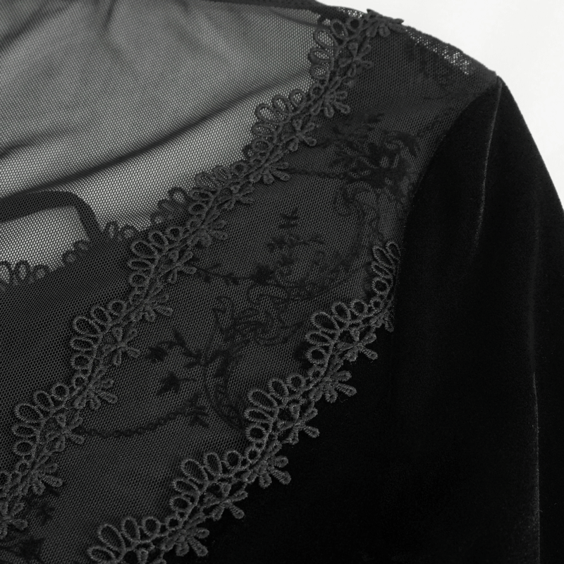 Close-up of gothic velvet dress neckline with intricate floral embroidery detail.