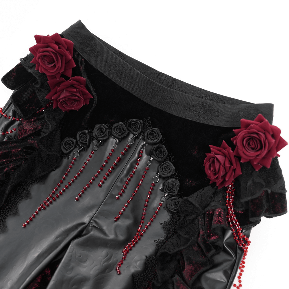 Gothic velvet flare pants featuring red rose appliqués, bead accents, and faux leather details for a dramatic flair.