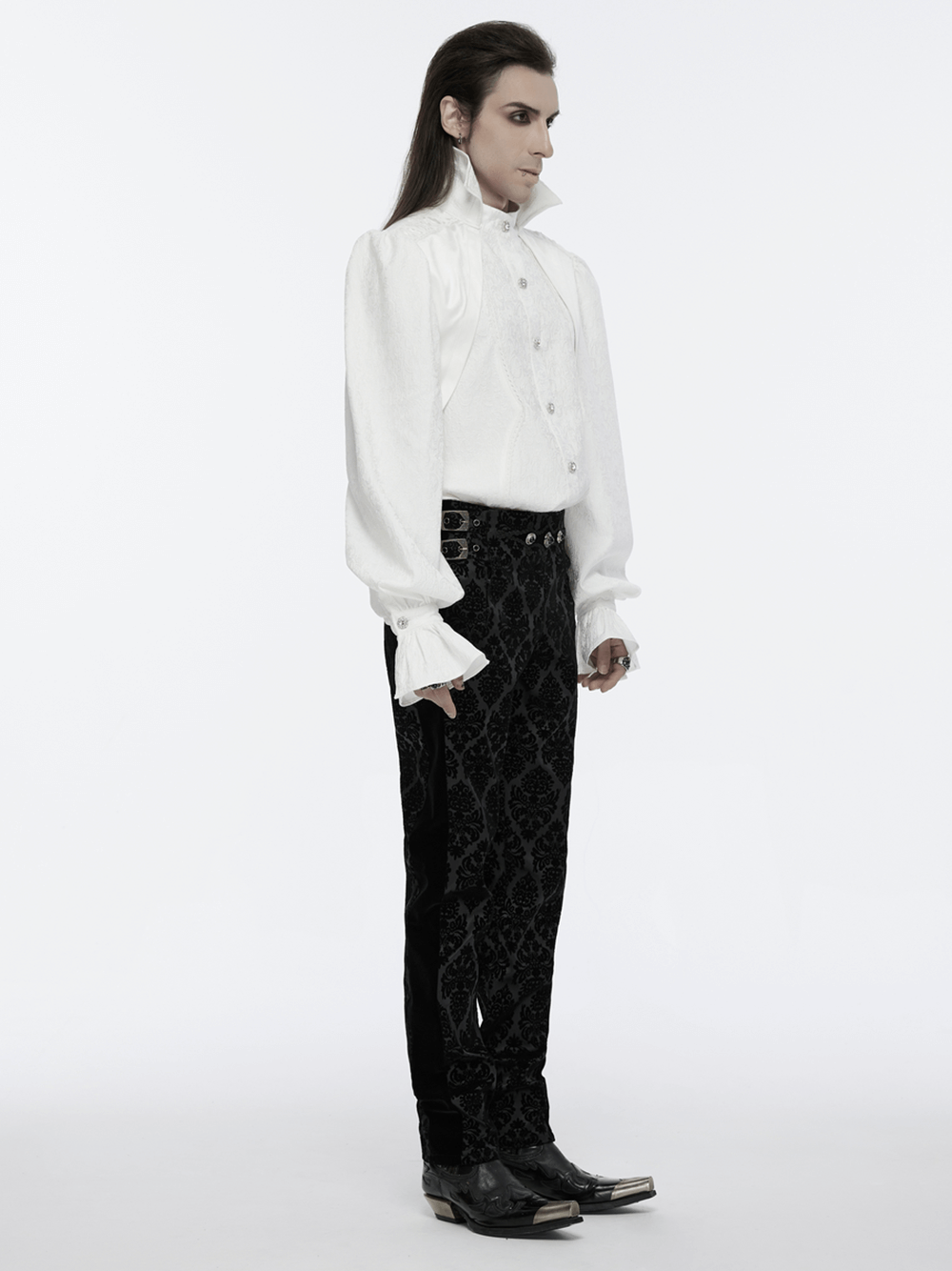 Model wearing Gothic Velvet Flocking Suit Pants with gemstone buckles and a stylish white shirt, showcasing edgy fashion.