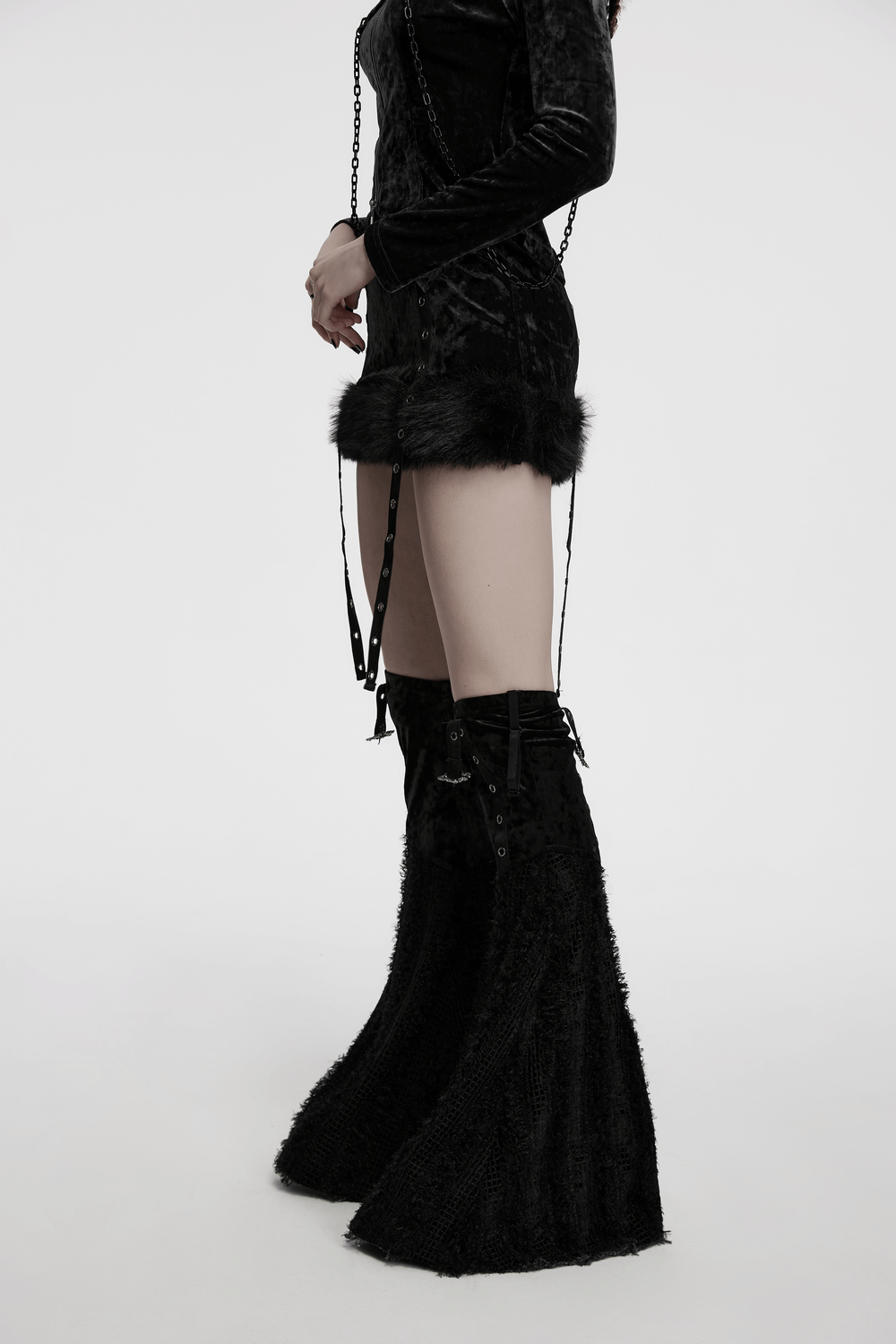 Gothic velvet skirt and detachable flare pants set with fur trim and straps, showcasing a stylish edgy look.