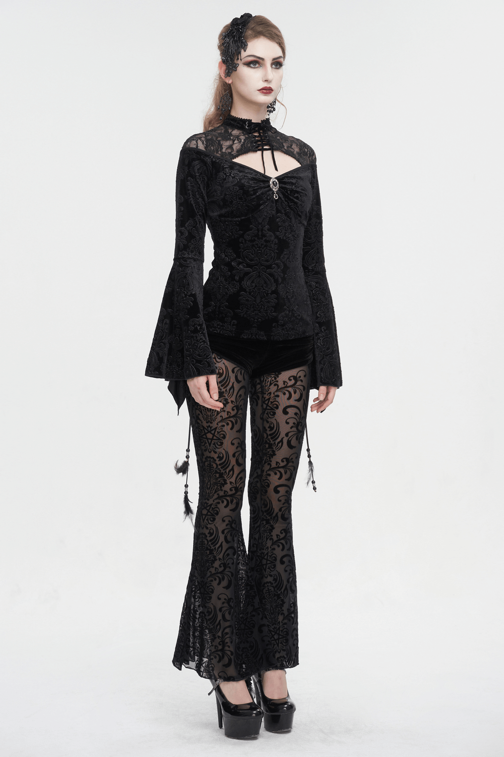 Gothic velvet V-neck top with long bell sleeves, paired with elegant sheer pants for a stylish gothic look.