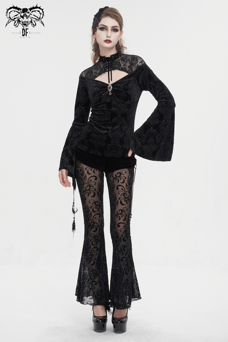 Stylish woman in gothic velvet V-neck top with long bell sleeves and lace flared pants, exuding a chic and dark aesthetic.