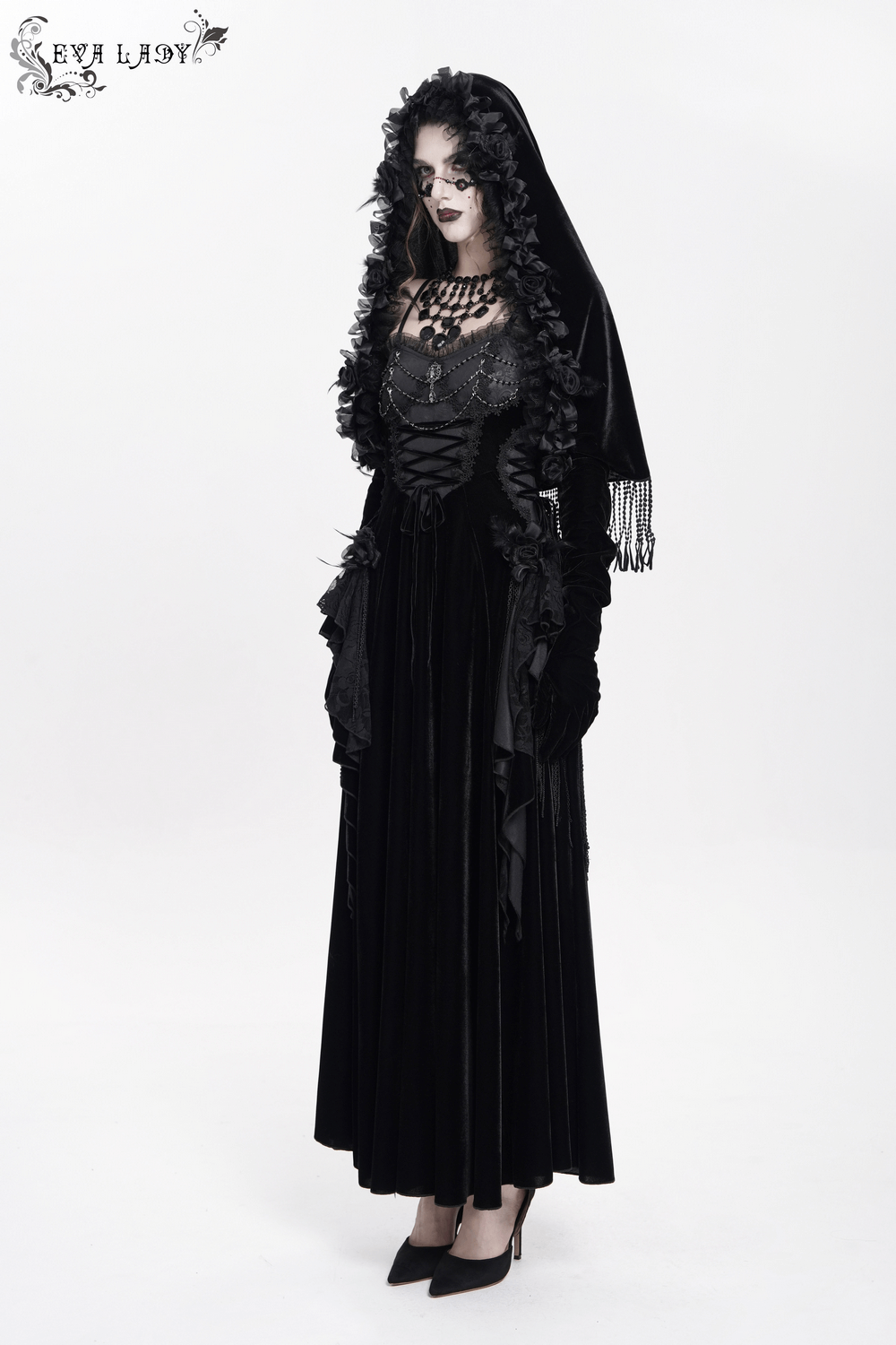 Gothic velvet hooded cape with floral detailing and fringe, perfect for vintage-inspired evening events.
