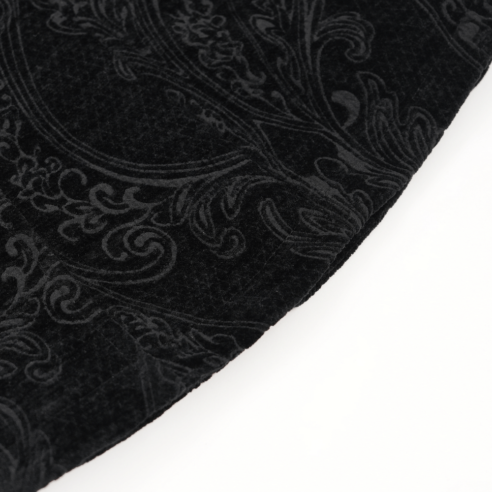 Close-up of the intricate velvet fabric with elegant black embroidery patterns for a gothic velvet jacket.