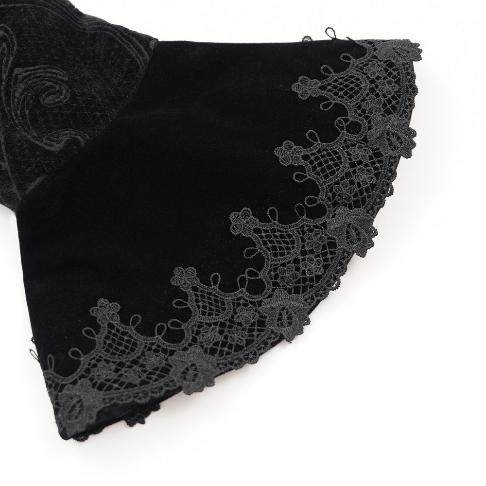 Close-up of black velvet bell sleeve with intricate lace trim on a Gothic jacket, perfect for alternative fashion.