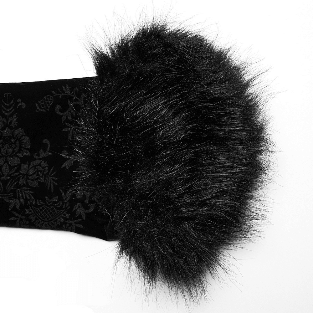 Close-up of black faux fur trim on a Gothic velvet jacket, showcasing luxurious texture and elegance.