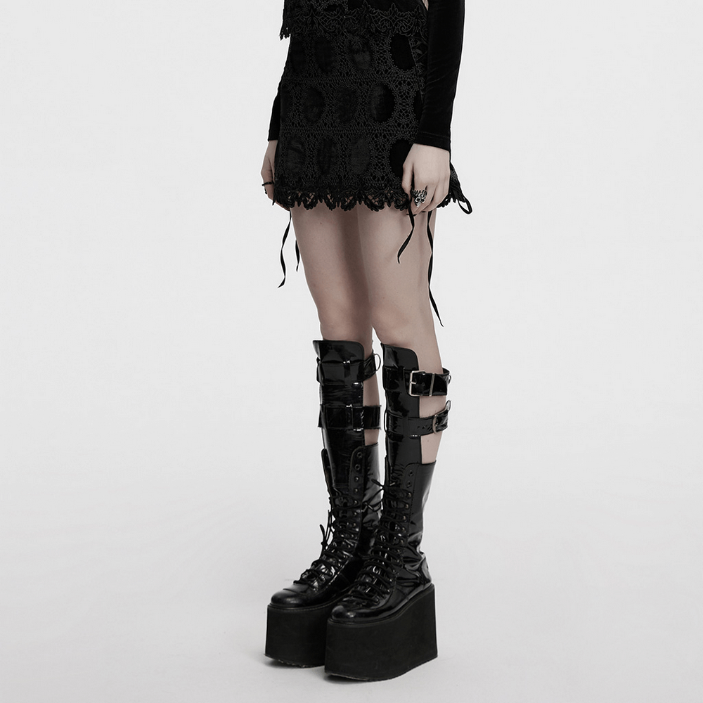 Gothic velvet mini skirt with lace trim, paired with chunky black platform boots for a dark alternative style.