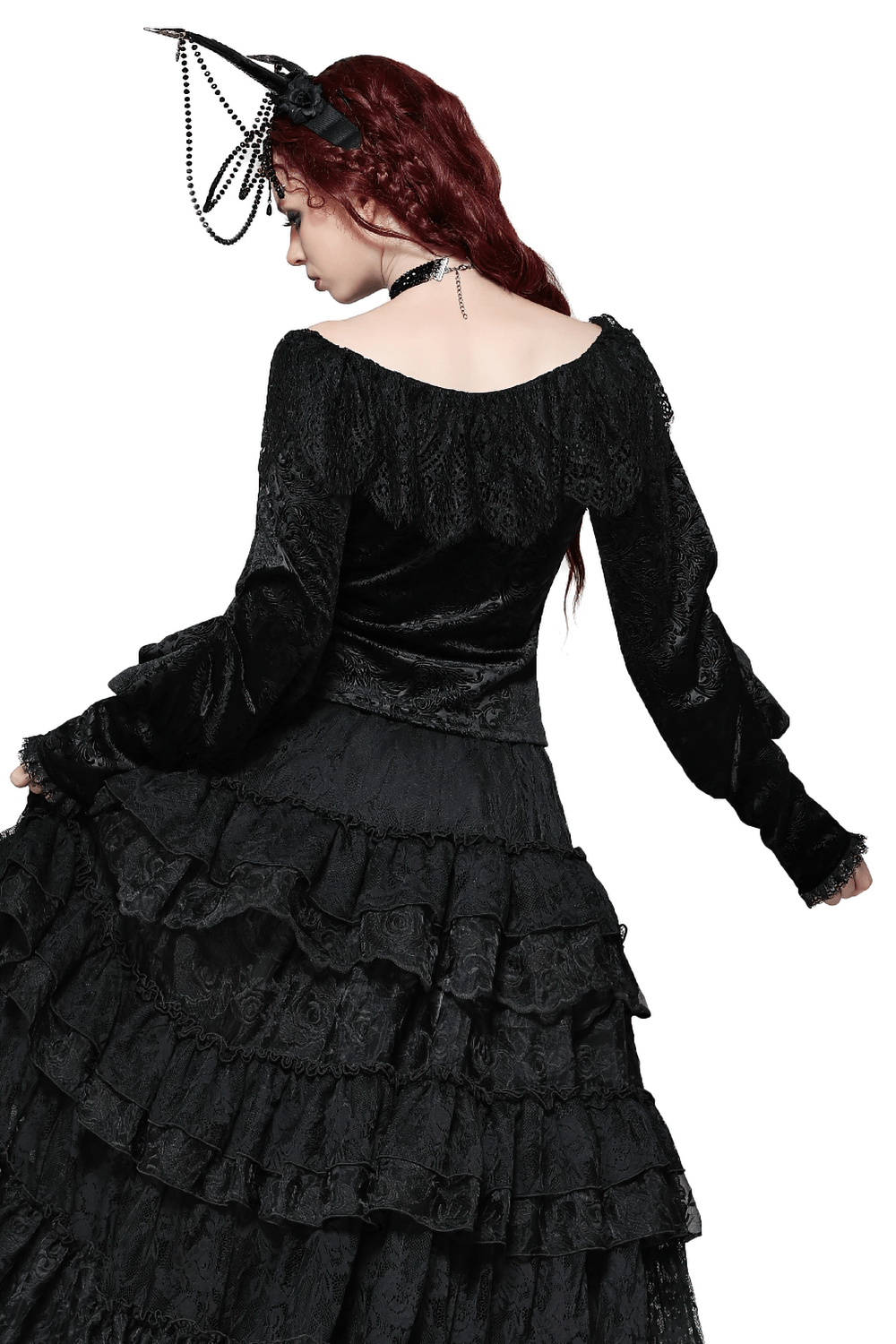 Woman in gothic velvet lace off-shoulder top, showcasing elegant vintage style and dramatic long sleeves.