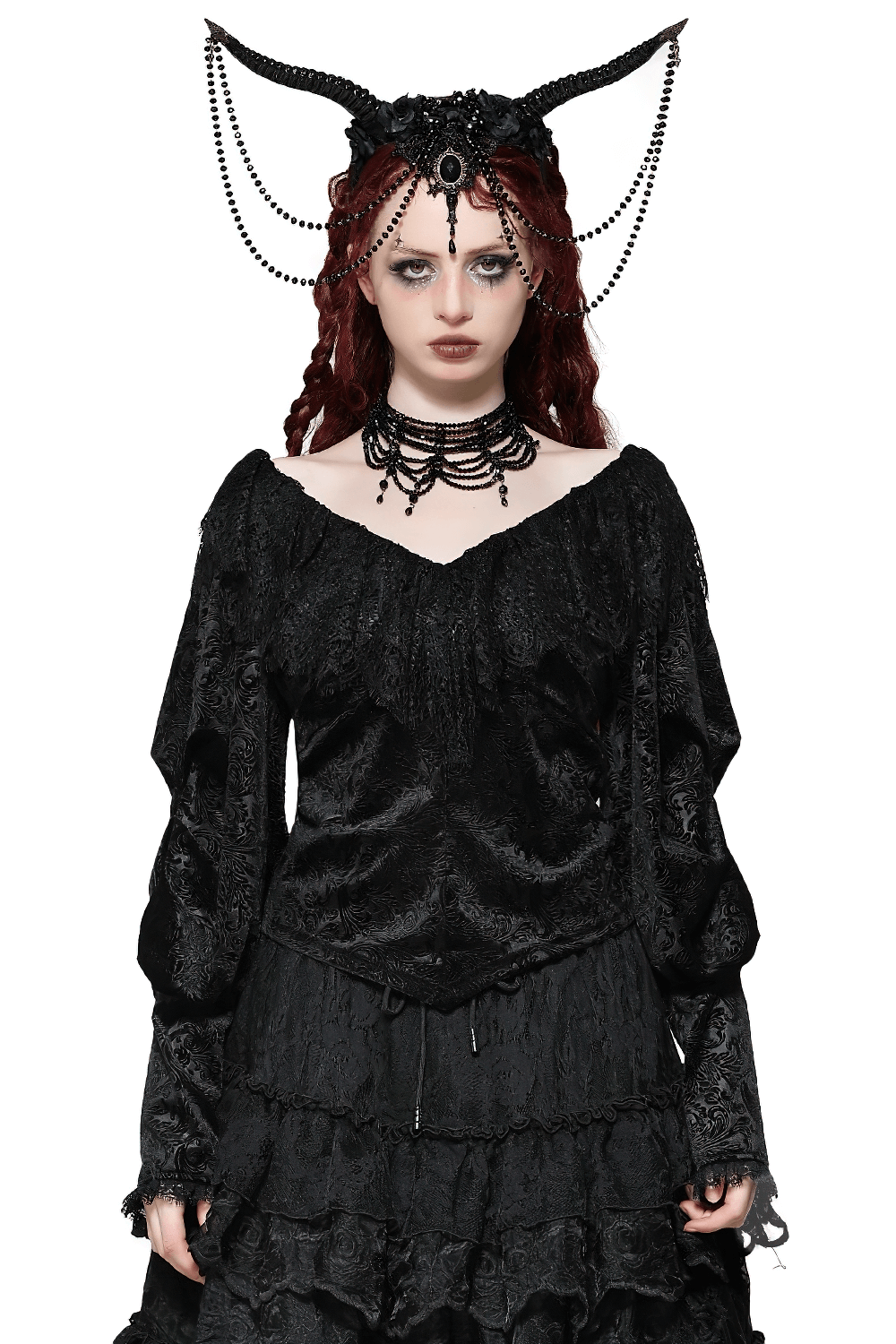 Elegant woman in gothic off-shoulder black lace velvet top, styled with dramatic accessories and dark romantic flair.