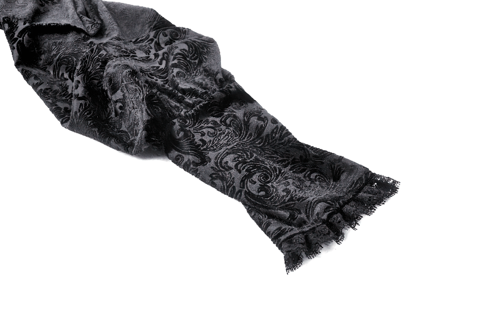 Elegant black velvet scarf with intricate patterns and fringed edges, perfect for gothic or vintage-inspired fashion.