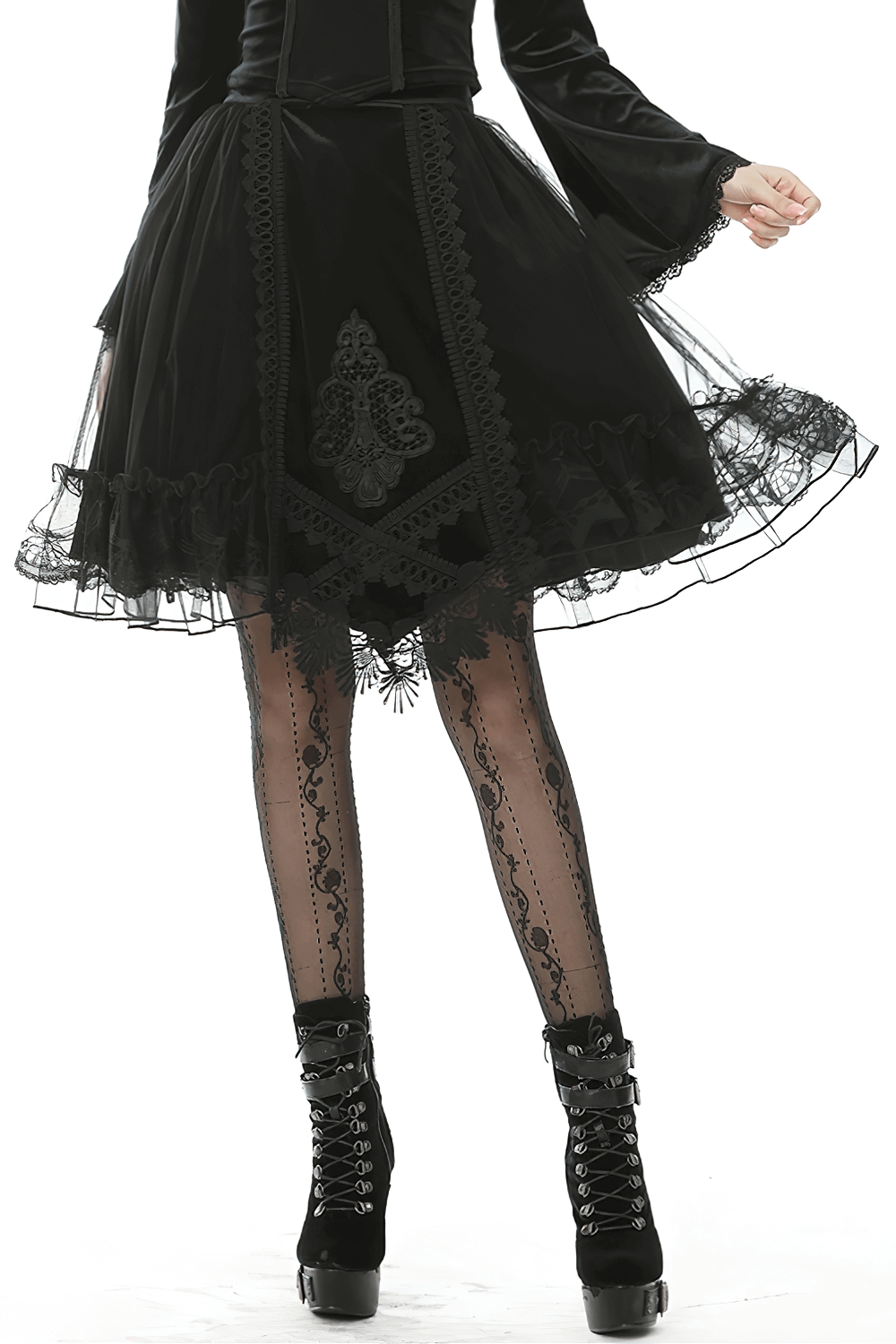 Black Gothic velvet and mesh skirt with lace trim, ribbon accents, and ruffled hemline, perfect for a Victorian-inspired look.