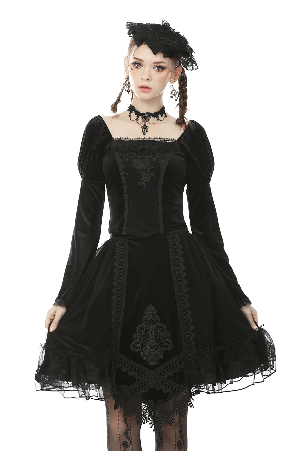 Elegant model wearing a black velvet Gothic dress with lace and puff sleeves, exuding Victorian charm and style.
