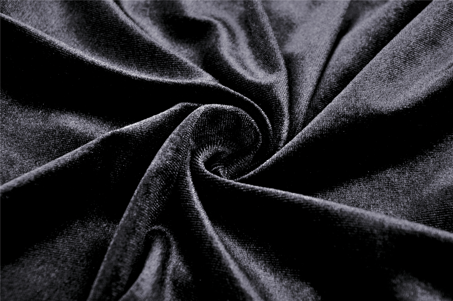 Close-up of luxurious black velvet fabric, perfect for a Gothic skirt with a soft, plush texture.
