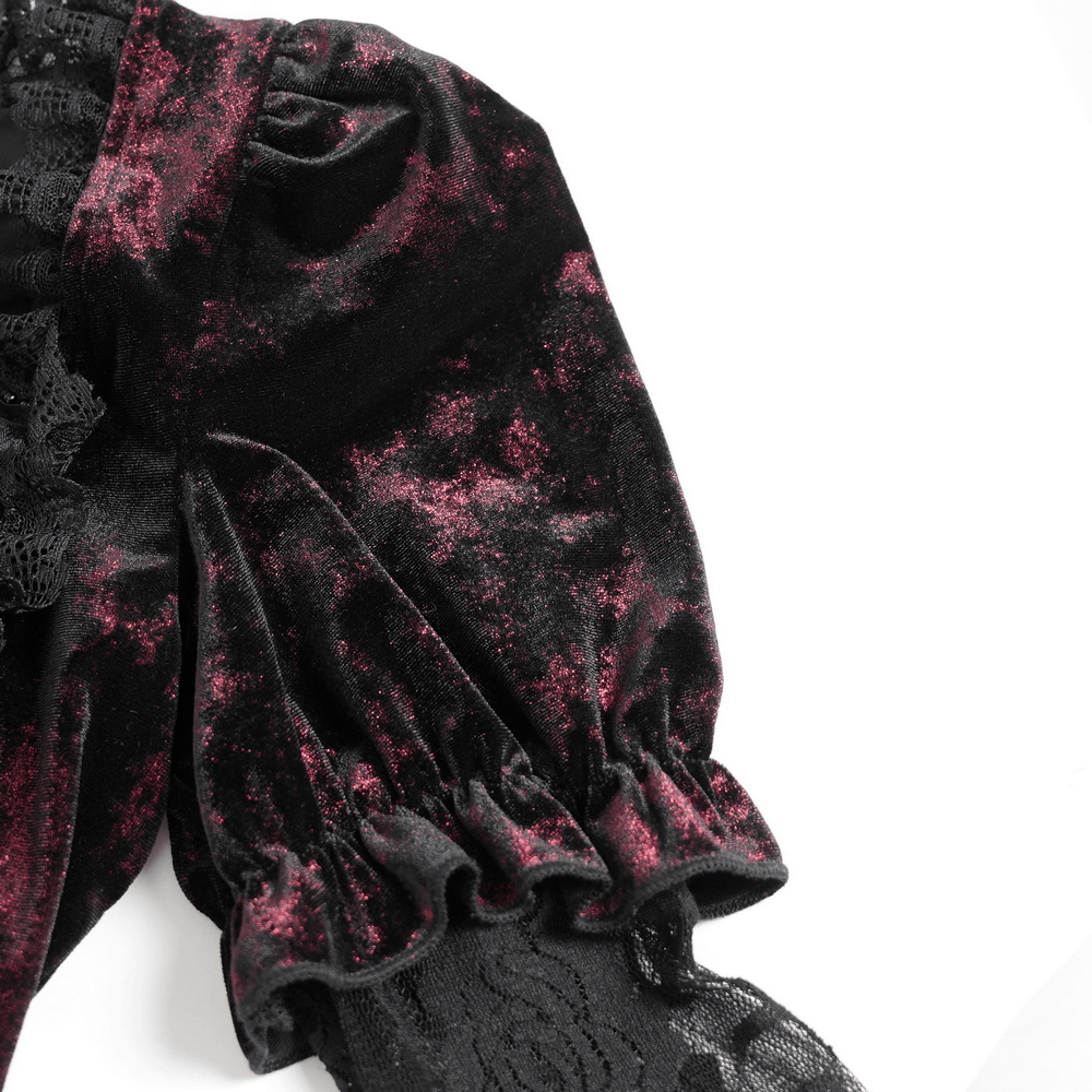 Close-up of gothic velvet top's sheer lace bell sleeve with ruched details and velvety texture, showcasing Victorian elegance.