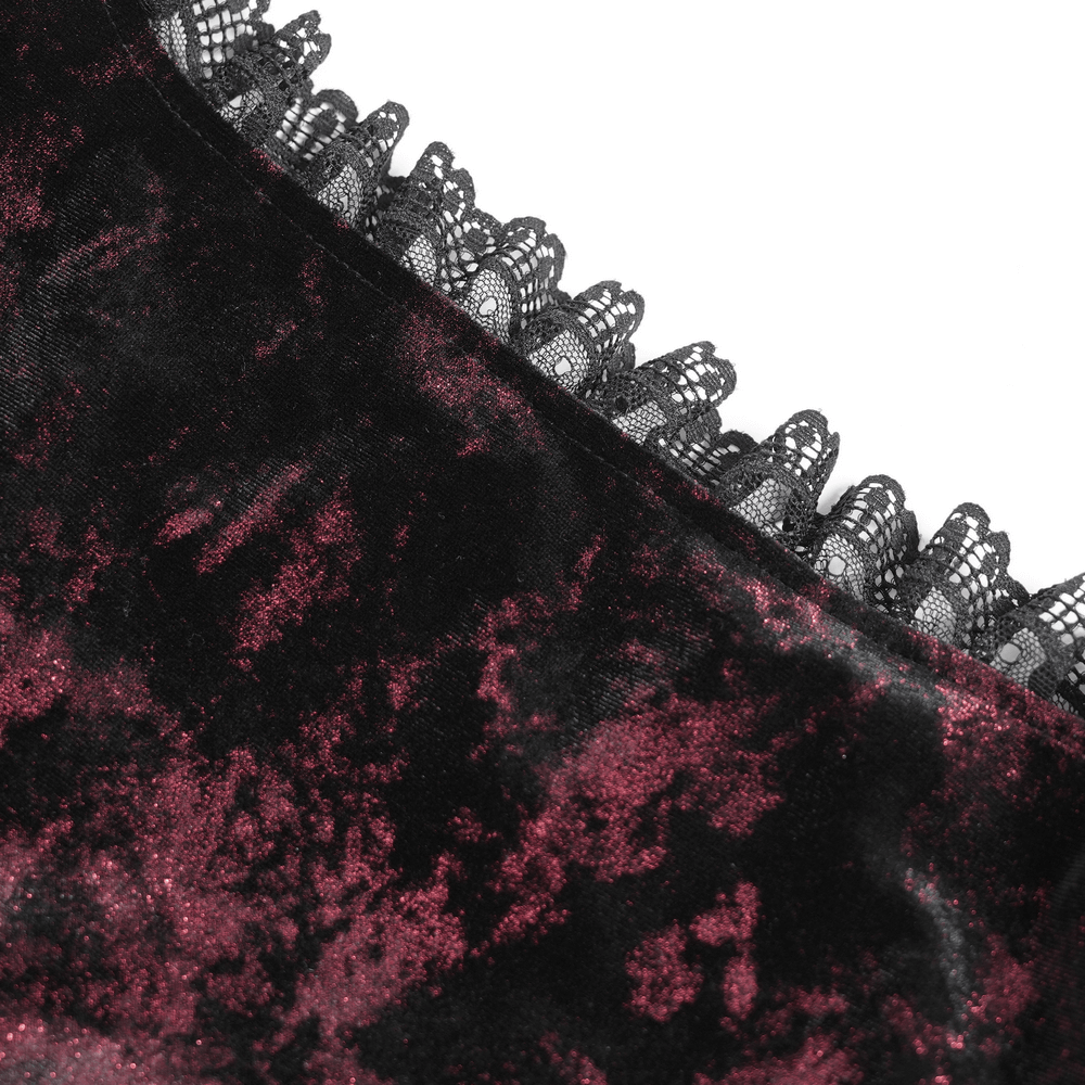 Close-up of gothic velvet top with sheer lace detailing, showcasing rich textures and Victorian elegance.