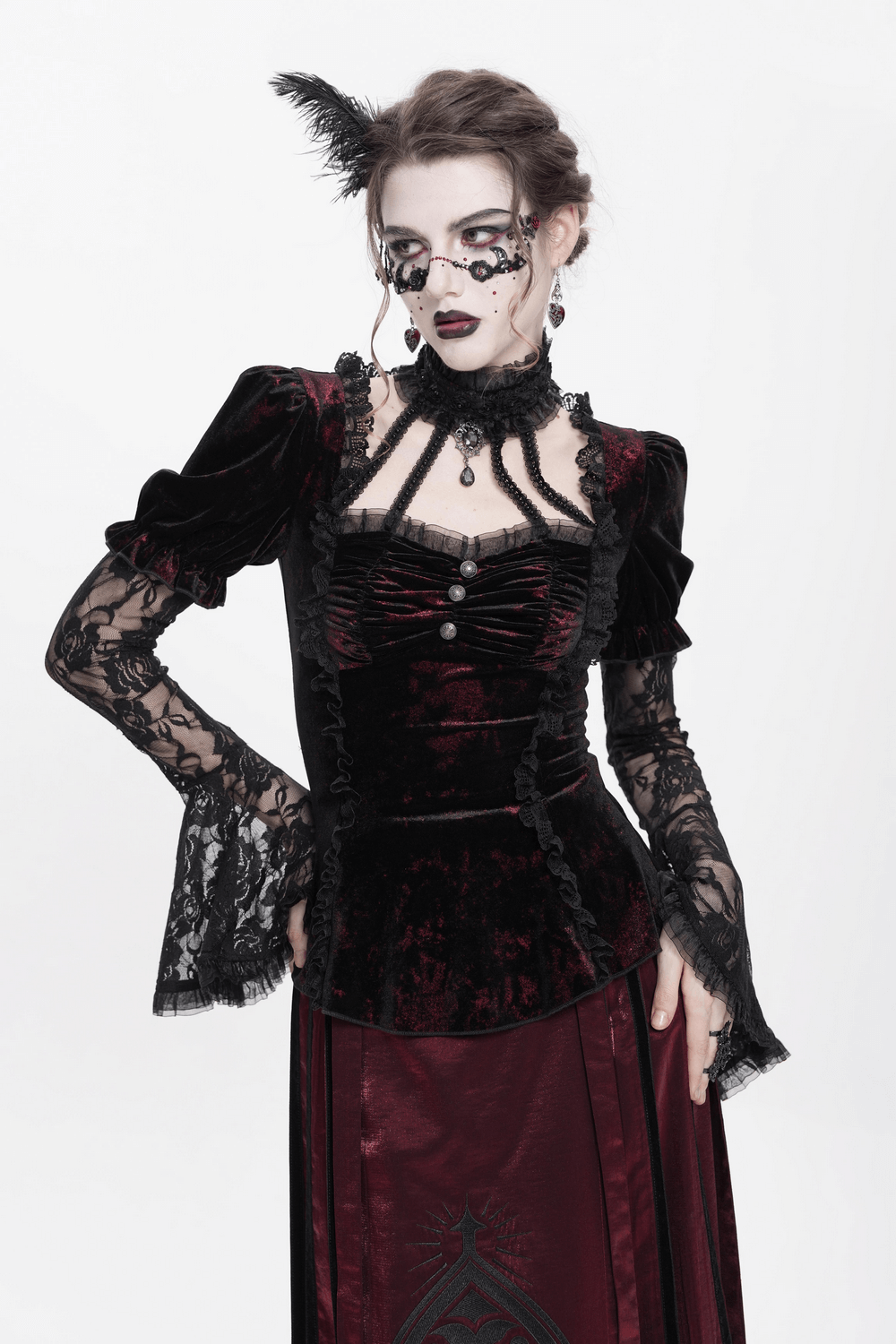 Gothic velvet top with lace sleeves, Victorian details, and a fitted silhouette, perfect for dark fashion enthusiasts.