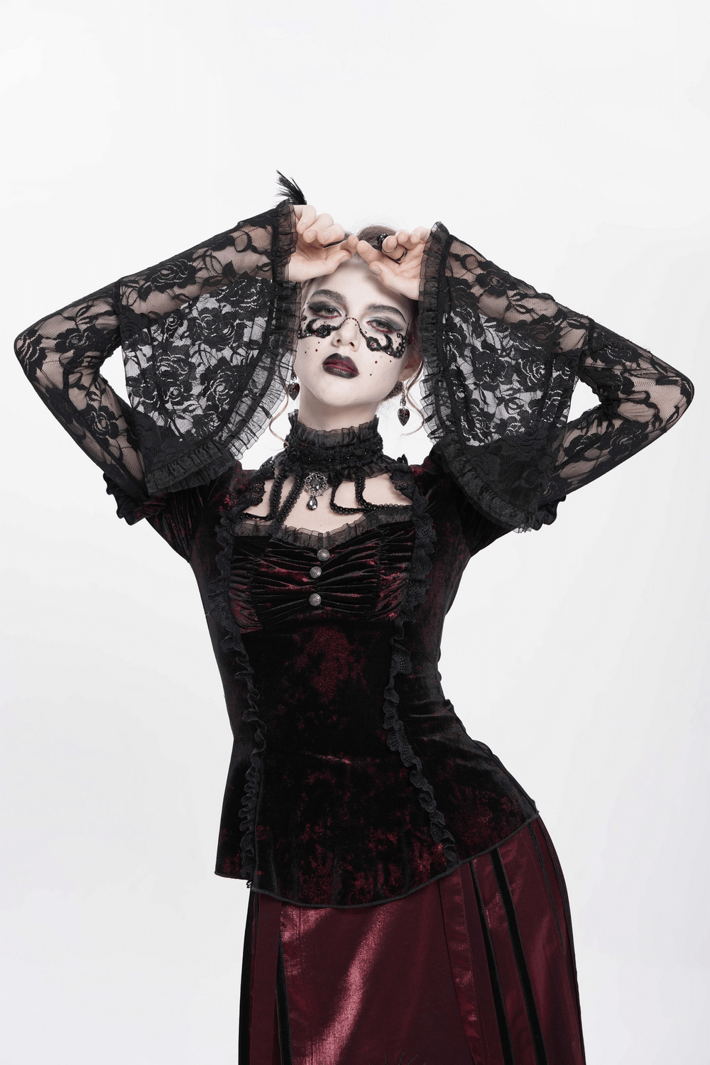 Victorian gothic velvet top with lace bell sleeves and puff shoulders, ideal for alternative fashion.