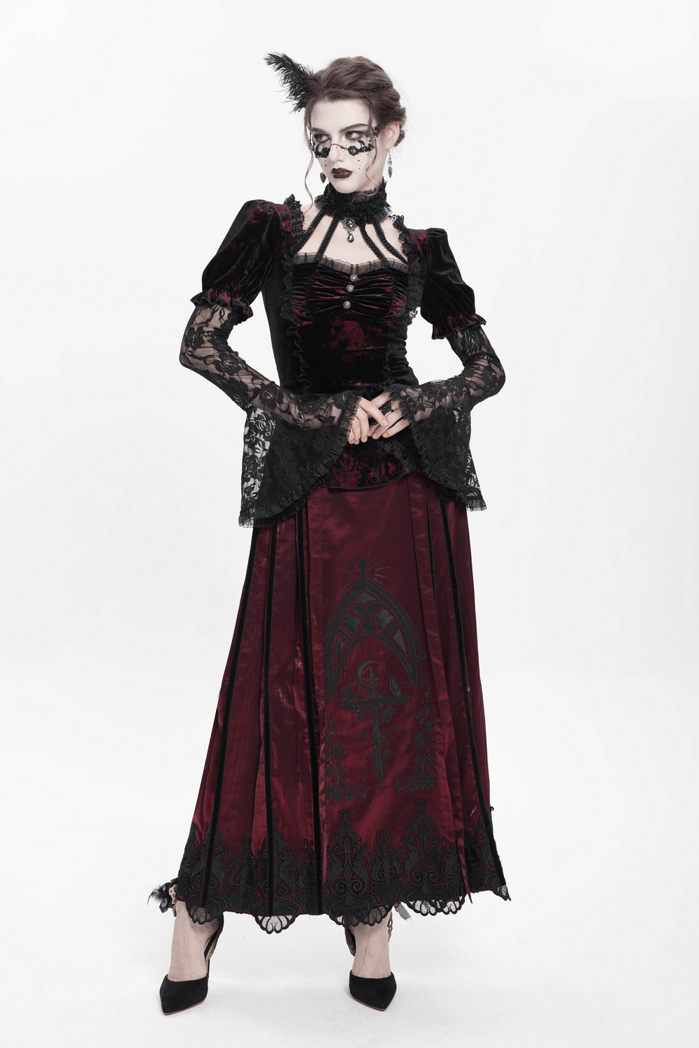 Gothic velvet lace sleeved top with Victorian details, featuring bell sleeves and a dramatic silhouette.