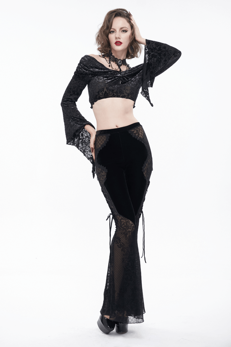 Model showcasing gothic velvet lace transparent flared trousers paired with a lace crop top in elegant black.