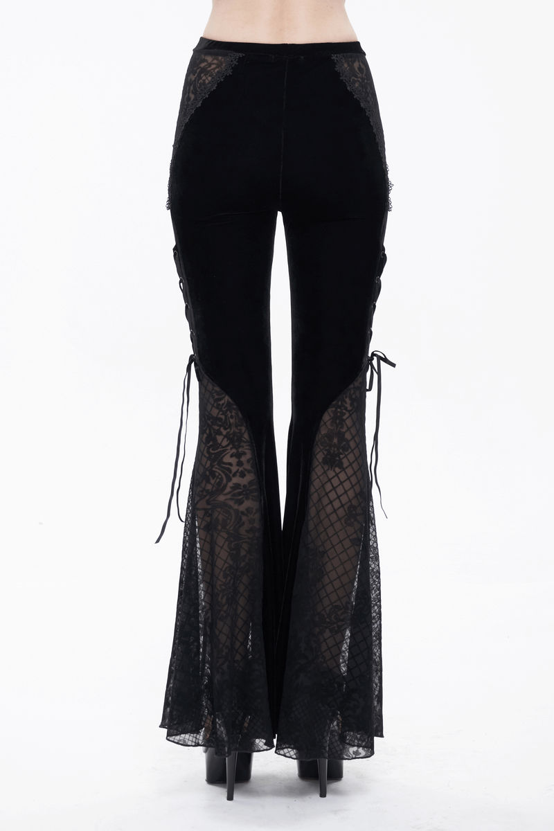 Back view of women's gothic black velvet flared trousers with lace panels and lace-up sides, elegant and stylish.