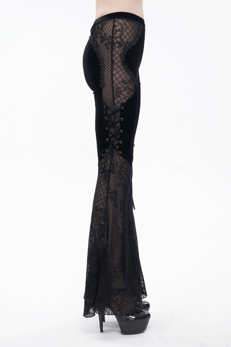 Elegant black velvet flared trousers with lace sides, ideal for gothic fashion lovers.