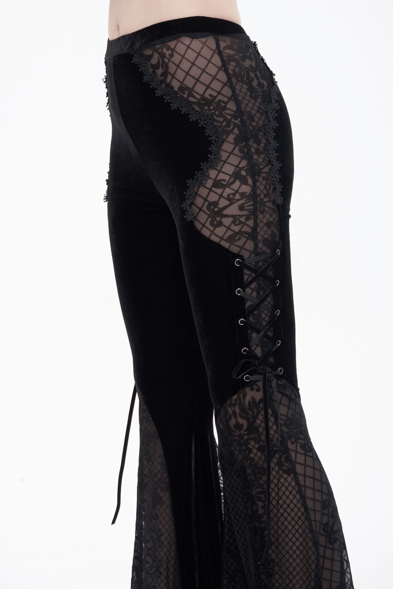 Women's gothic black velvet flared trousers with lace panels and side laces, elegant and stylish design.