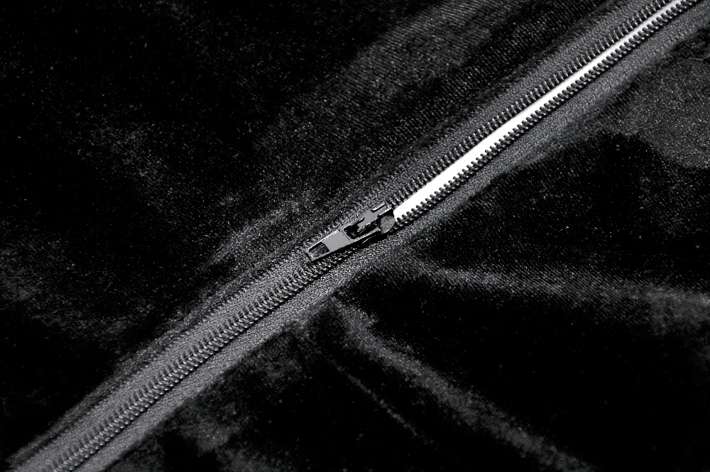 Close-up of the zipper detail on a Gothic Velvet Lace-Up Corset Top with Sheer Detailing, showcasing its luxurious fabric.