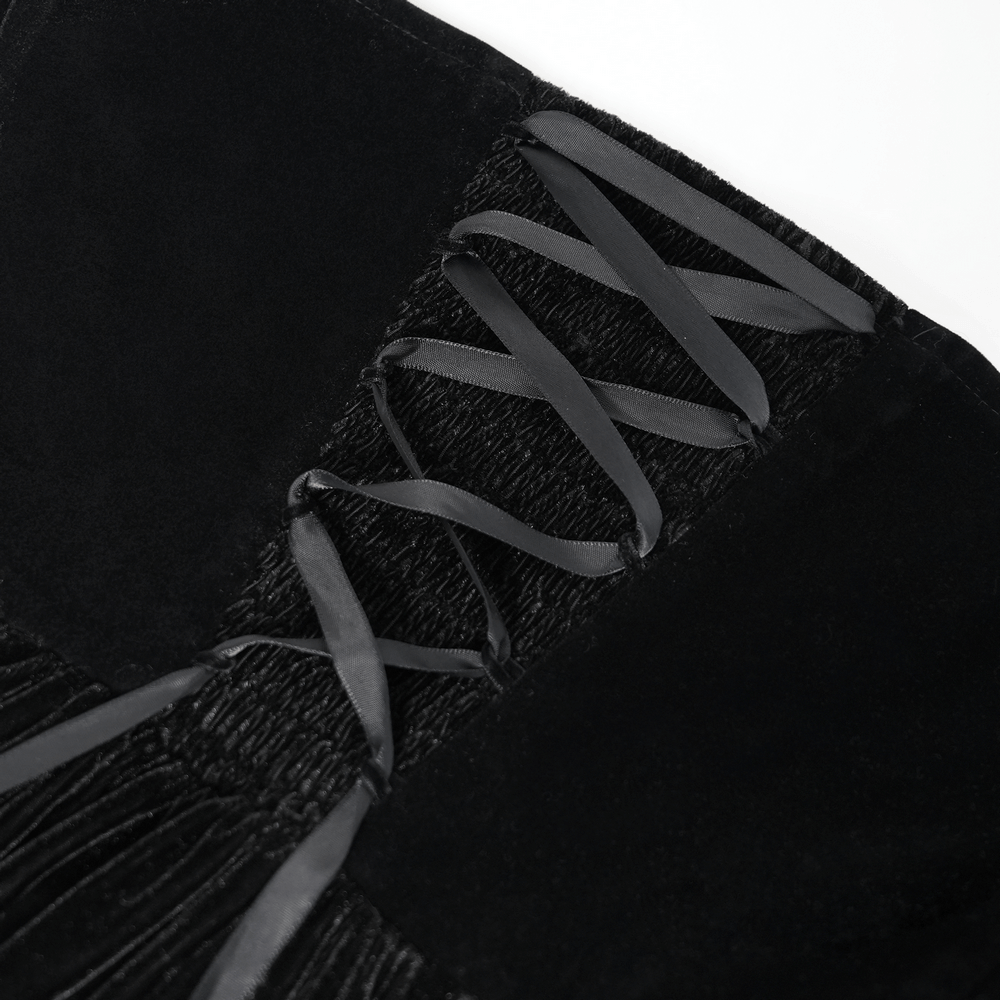 Close-up of black velvet lace-up corset detailing on a gothic maxi dress, showcasing elegant ribbon laces.