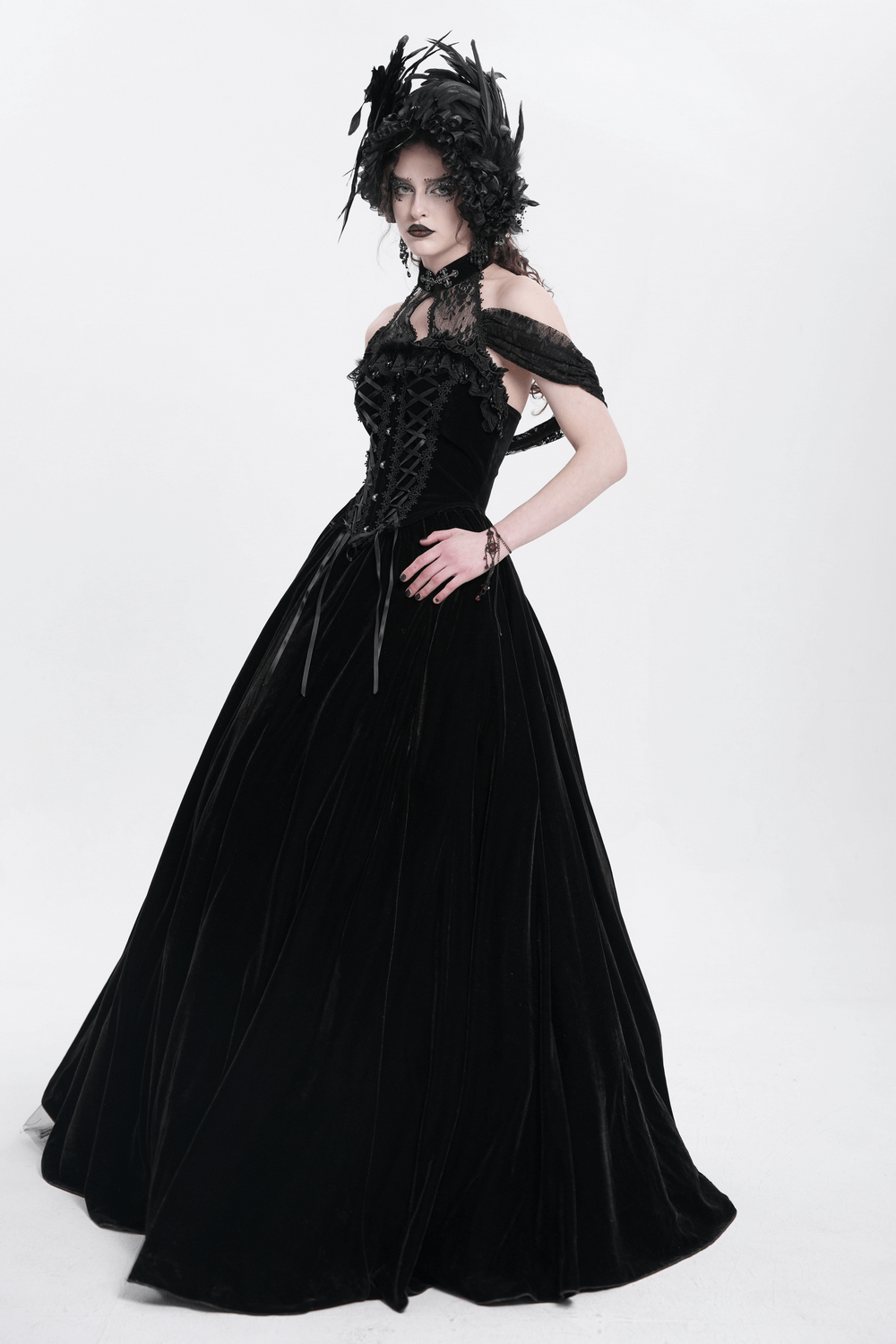 Elegant gothic black velvet maxi dress with lace-up corset and off-shoulder design, perfect for formal events.
